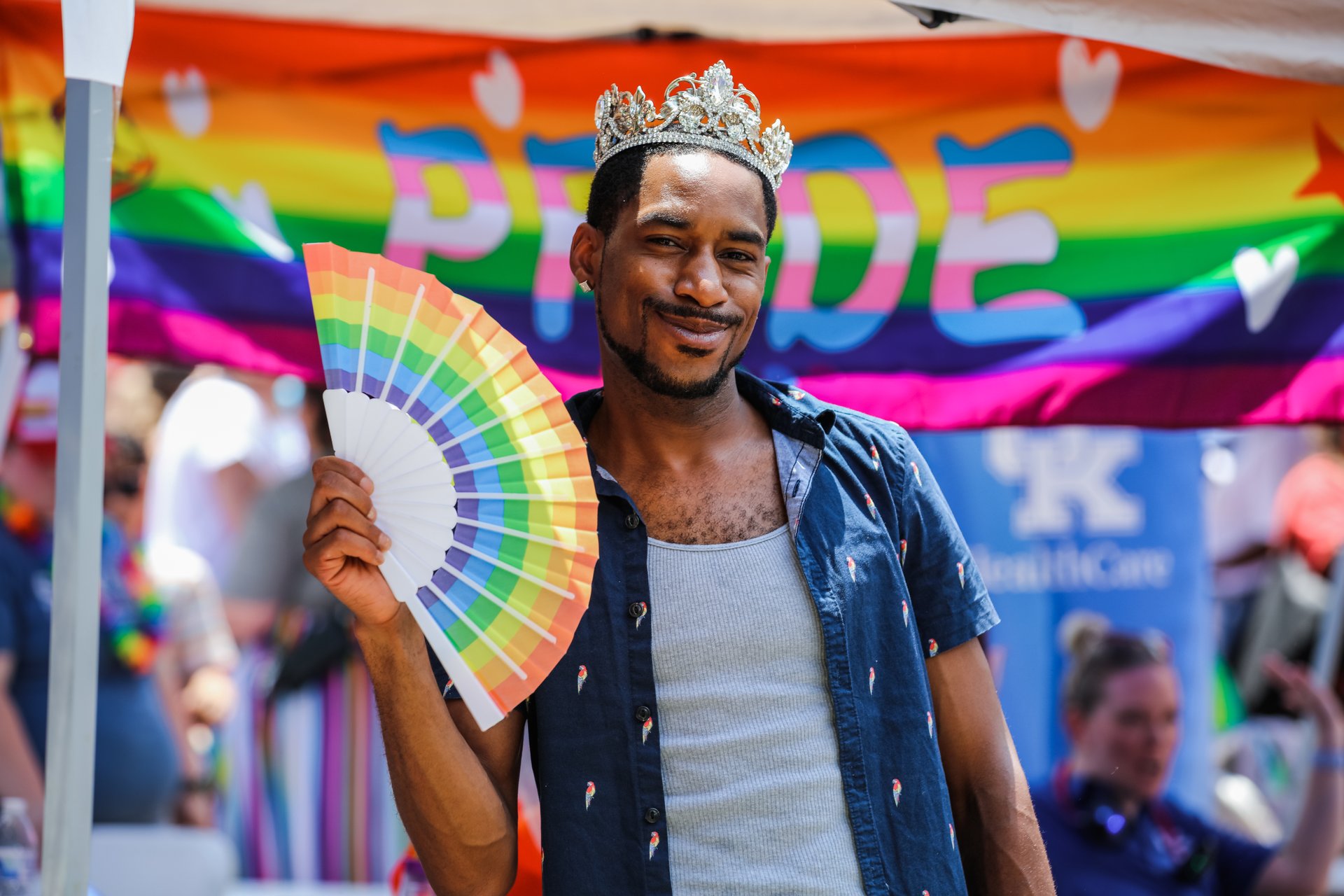 Person holding pride flag.