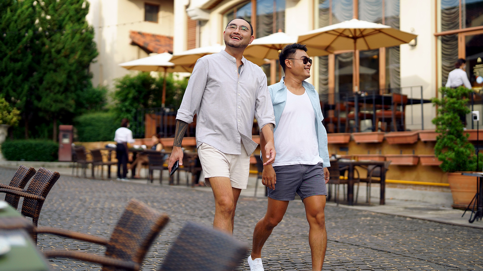 Two men walking in city